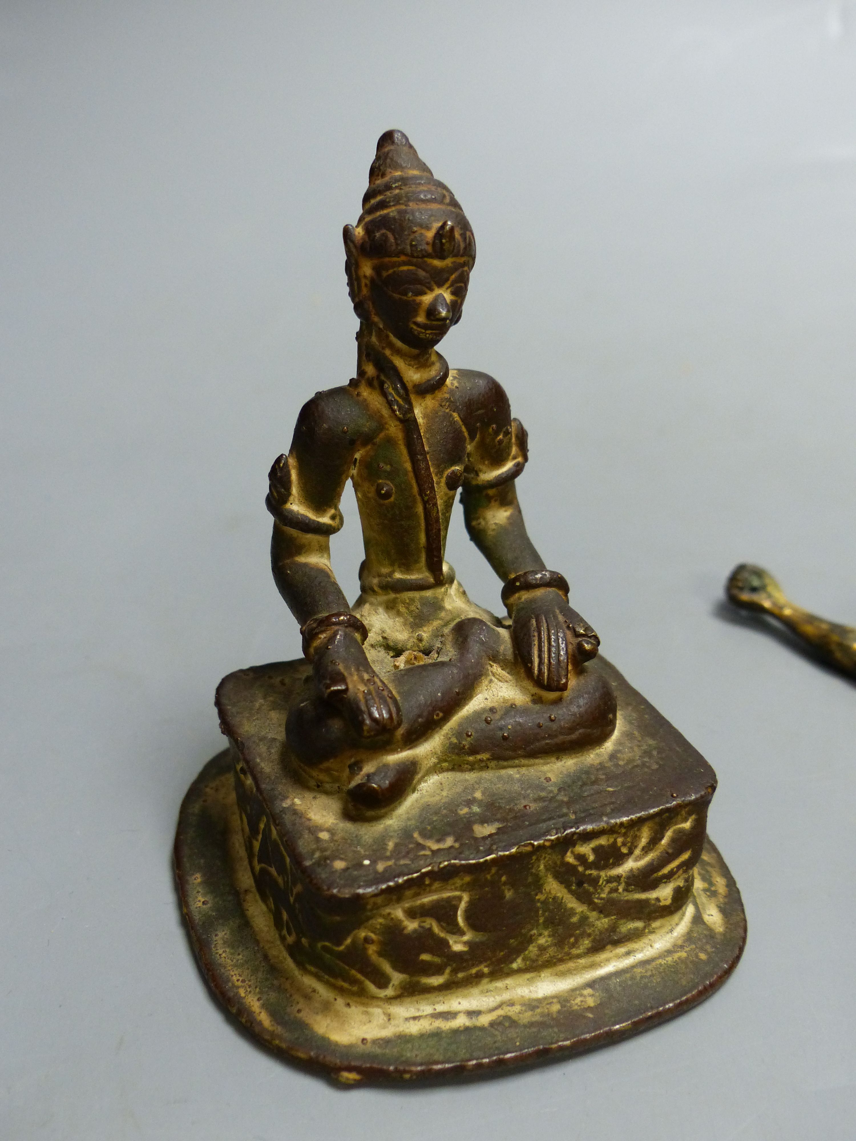 An Indian Buddhist figure and a gilt bronze Corpus Christi, largest 13cm